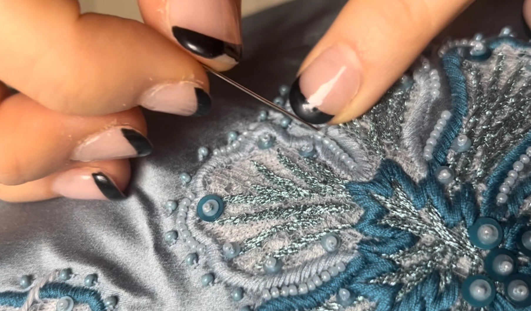 Close-up of Polish embroidery, a piece of fabric with intricate patterns.